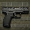 Walther PDP Compact 4-inch 9mm pistol side profile resting on a neutral background