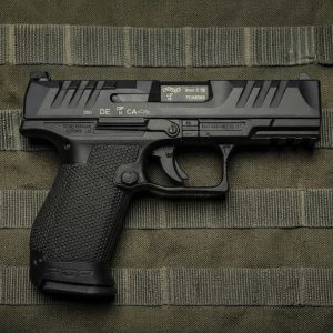 Walther PDP Compact 4-inch 9mm pistol side profile resting on a neutral background
