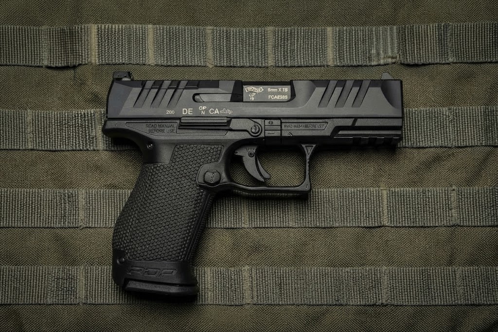 Walther PDP Compact 4-inch 9mm pistol side profile resting on a neutral background