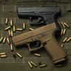 two GLOCK 43 Subcompact 9mm pistol brown and black side profile resting on a neutral background buy GLOCK 43 Subcompact 9mm pistol online