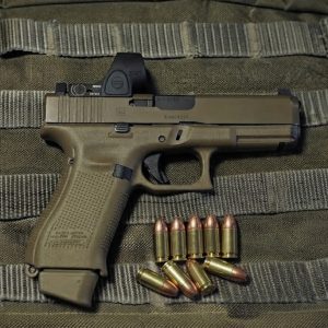 glock 19 semi auto image on a green bg with some 9mm luger ammunition