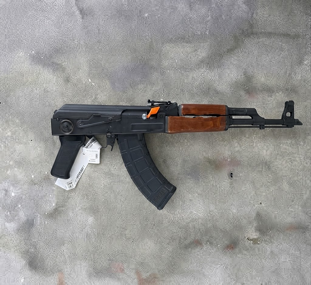Zastava PAP M70 Yugoslavian AK-47 rifle side profile resting on a neutral background