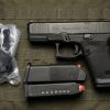 Glock 19 Gen 6 9mm semi-auto pistol side profile resting on a neutral background