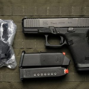 Glock 19 Gen 6 9mm semi-auto pistol side profile resting on a neutral background