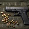 Glock 17 Gen 6 9mm semi-auto pistol side profile resting on a neutral background